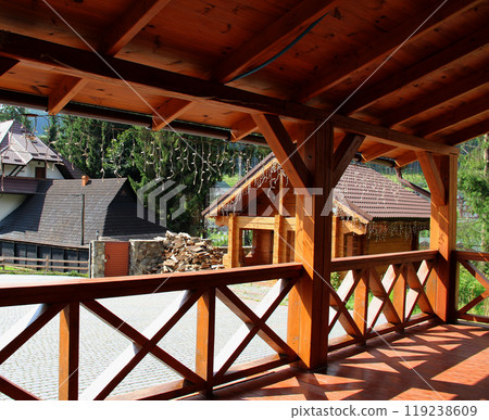View from the porch of a wooden house to the courtyard in the countryside 119238609