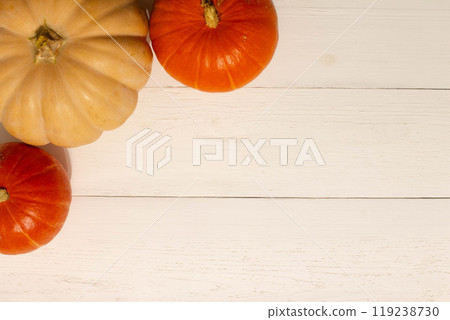 Halloween background with pumpkins. Flat lay. Frame with Halloween figures on white table, top view. Hallowen decorations for greeting and invitation. Happy Helloween concept. Holidays background Halloween background with pumpkins. Flat lay. Frame with Halloween figures on white table, top view. Hallowen decorations for greeting and invitation. Happy Helloween concept. Holidays background 119238730
