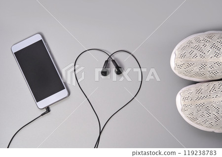 Fitness motivation with smartphone and earphones active lifestyle inspiration Fitness motivation with smartphone and earphones active lifestyle inspiration 119238783