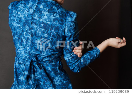 Back of Blue dress, fabric belt tied with a bow. Women's clothing item 119239089