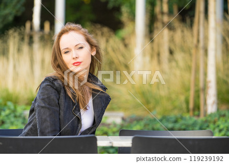 Woman waiting in outdoor restaurant cafe. Woman waiting in outdoor restaurant cafe. 119239192