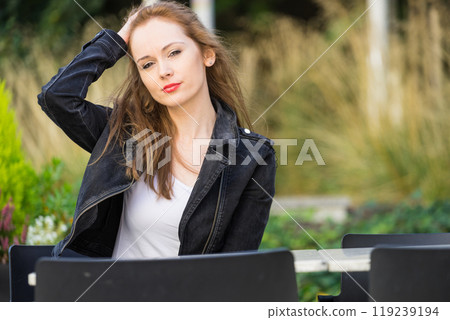 Woman waiting in outdoor restaurant cafe. Woman waiting in outdoor restaurant cafe. 119239194