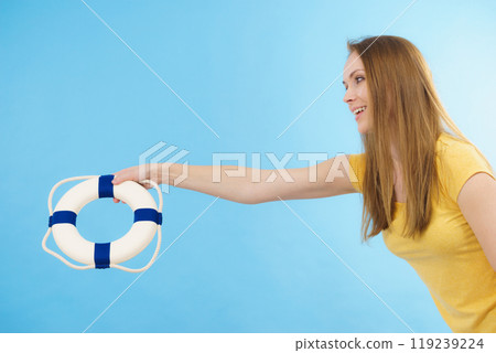 Girl holds life buoy rescue ring 119239224