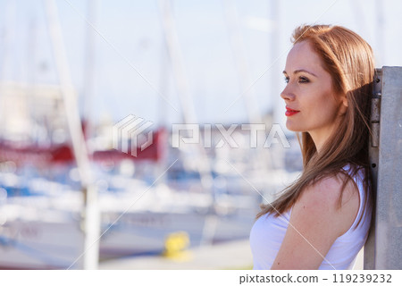 Woman walking in marina 119239232