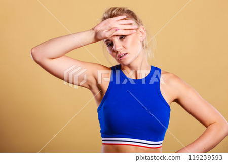 fitness woman with headache migraine pain 119239593