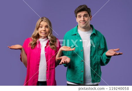 Confused man woman, couple shoulders up - can't help, makes gesture of dont know Confused man woman, couple shoulders up - can't help, makes gesture of dont know 119240058