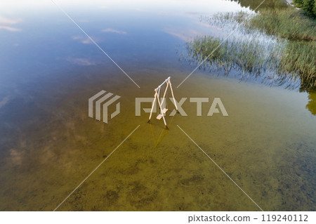 Wooden swing on White Lake. Rivne region, Ukraine. Wooden swing on White Lake. Rivne region, Ukraine. 119240112
