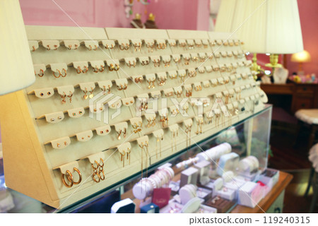 Jinju-si, Gyeongsangnam-do, Republic of Korea - 2024-01-10: Beautiful 24K gold jewelry with designs similar to luxury items on display at a Korean jewelry store Jinju-si, Gyeongsangnam-do, Republic of Korea - 2024-01-10: Beautiful 24K gold jewelry with designs similar to luxury items on display at a Korean jewelry store 119240315
