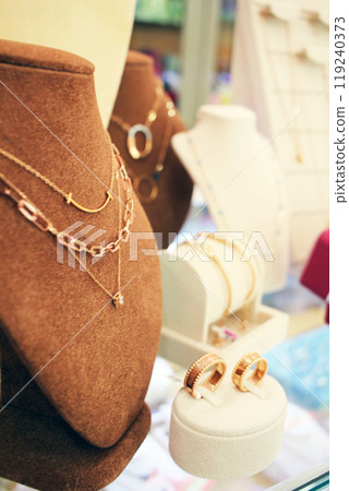 Jinju-si, Gyeongsangnam-do, Republic of Korea - 2024-01-10: Beautiful 24K gold jewelry with designs similar to luxury items on display at a Korean jewelry store 119240373