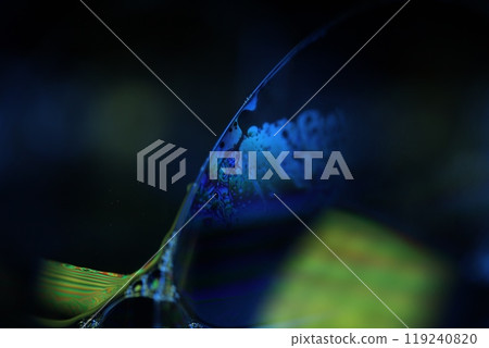 Blue reflections of liquid in macro, blue and Green colors, rainbow, Black and silver bubbles in macro, connection of bubbles in macro, cell from liquid, molecules connection, fantastic atmosphere Blue reflections of liquid in macro, blue and Green colors, rainbow, Black and silver bubbles in macro, connection of bubbles in macro, cell from liquid, molecules connection, fantastic atmosphere 119240820