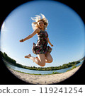 American woman expressing joy on the beach 119241254