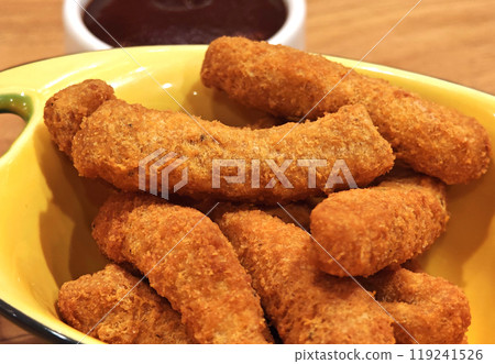 Crispy chicken finger sticks with bbq sauce 119241526