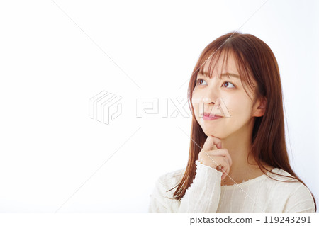 A young woman thinking with a troubled look A young woman thinking with a troubled look 119243291