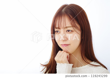A young woman thinking with a troubled look A young woman thinking with a troubled look 119243299