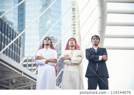 Arab team hold digital tablet uae union teamwork people. Digital marketing arab group of people using smart tablet discuss modern muslim UAE city. Entrepreneur Asian people smile teams meeting. Arab team hold digital tablet uae union teamwork people. Digital marketing arab group of people using smart tablet discuss modern muslim UAE city. Entrepreneur Asian people smile teams meeting. 119244676