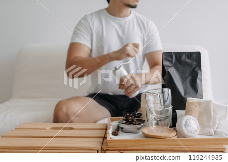 Step by step of man making espresso with hand press tools. Step by step of man making espresso with hand press tools. 119244985