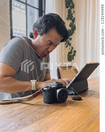 Furious photographer man working in rush as it is at deadline. Furious photographer man working in rush as it is at deadline. 119244999