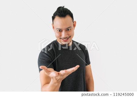Happy freelance man bun hair in black with thing in hand on white. Happy freelance man bun hair in black with thing in hand on white. 119245000