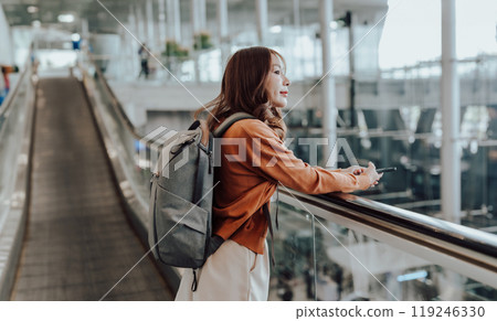 Young asian woman in international airport terminal or modern train station 119246330