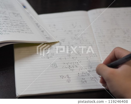 A study desk with notebooks and workbooks 119246408