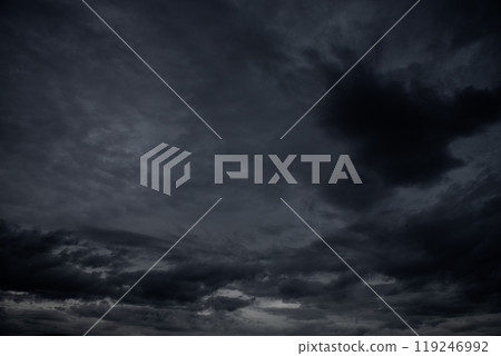Dramatic dark storm rain clouds black sky background. Dark thunderstorm clouds rainny atmosphere. Meteorology danger windstorm disasters climate. Dark cloudscape storm disaster gloomy gray cloud sky Dramatic dark storm rain clouds black sky background. Dark thunderstorm clouds rainny atmosphere. Meteorology danger windstorm disasters climate. Dark cloudscape storm disaster gloomy gray cloud sky 119246992