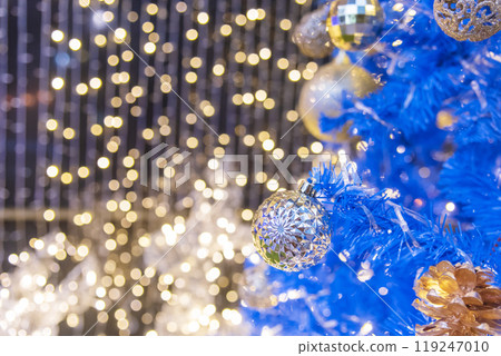 Golden Christmas Ornament sparkling blurred background. Golden glitter shiny illuminated Christmas Lights banner. Happy Holidays background for template on christmas card Gold bokeh presentation. Golden Christmas Ornament sparkling blurred background. Golden glitter shiny illuminated Christmas Lights banner. Happy Holidays background for template on christmas card Gold bokeh presentation. 119247010
