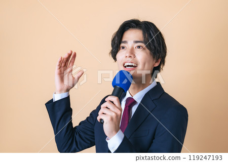 A man singing with a microphone 119247193