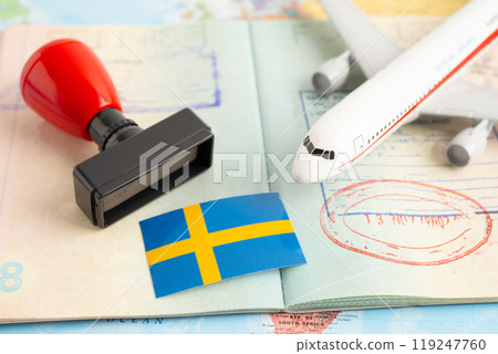 Approved Stamp  passport with Sweden flag document to immigration at airport in country. 119247760