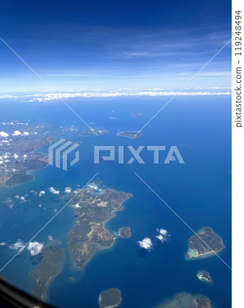 Beautiful view of the ocean and the islands from the plane window Beautiful view of the ocean and the islands from the plane window 119248494