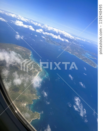Beautiful view of the ocean and the islands from the plane window Beautiful view of the ocean and the islands from the plane window 119248495