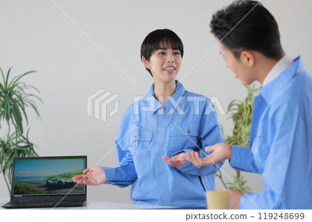 Female engineer giving a presentation on car design_1 Female engineer giving a presentation on car design_1 119248699