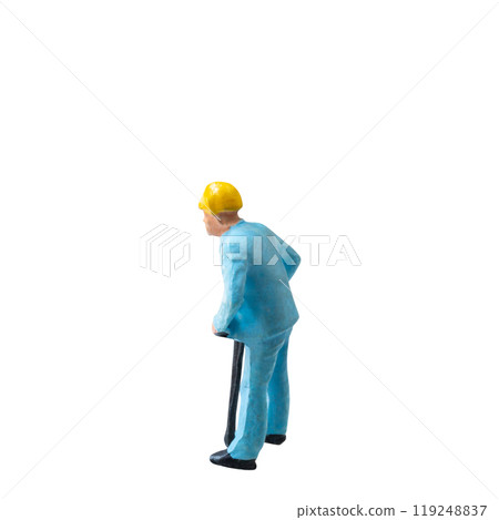 Miniature construction worker in a blue uniform isolate on white background with clipping path Miniature construction worker in a blue uniform isolate on white background with clipping path 119248837