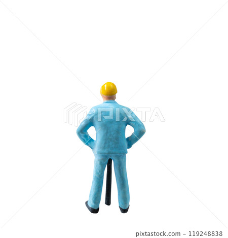 Miniature construction worker in a blue uniform isolate on white background with clipping path 119248838