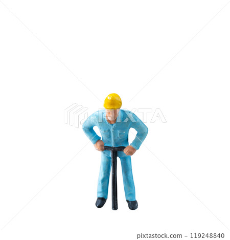 Miniature construction worker in a blue uniform isolate on white background with clipping path 119248840
