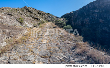Rugged Mountain Trail with Ancient Cobblestone Pathway Rugged Mountain Trail with Ancient Cobblestone Pathway 119249098