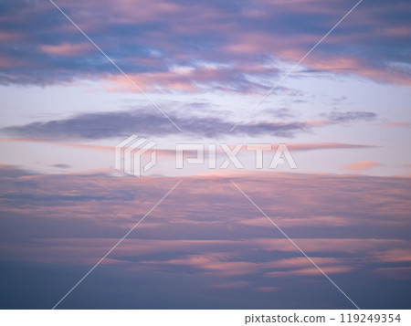 Beautiful blue evening sky with various fluffy clouds and pink orange sunset sunrise background texture 119249354