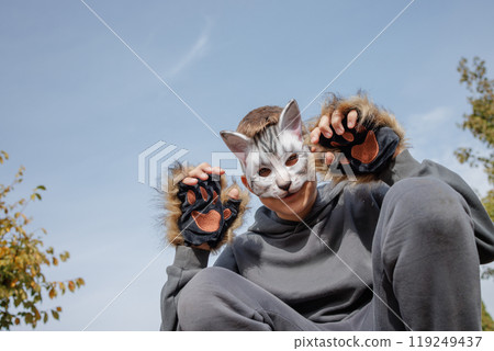 quadrobics teenager in cat mask sits on all fours in park, quadrobika subculture quadrobics teenager in cat mask sits on all fours in park, quadrobika subculture 119249437