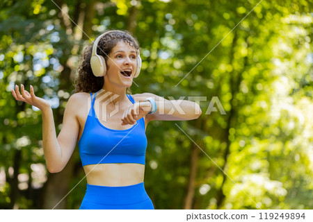 Athletic fitness sport runner woman finishing racing competition victory success workout cardio 119249894