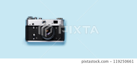 A vintage retro camera placed flat on a bright blue background A vintage retro camera placed flat on a bright blue background 119250661