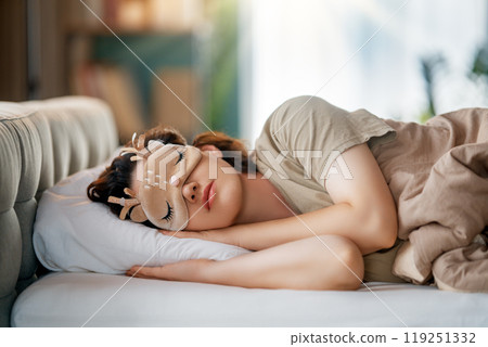 woman is sleeping in the bedroom 119251332