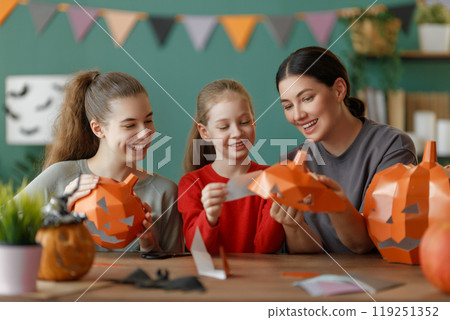 Happy family preparing for Halloween. Happy family preparing for Halloween. 119251352