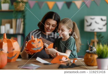 Happy family preparing for Halloween. Happy family preparing for Halloween. 119251416