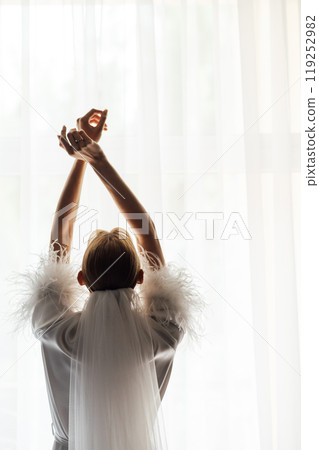 A tender bride strokes her body with her hands and sensually touches her skin. Sensual moment 119252982