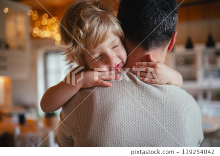 Father is holding his little son in his arms, hugging him. Fatherhood and Father's Day. Father is holding his little son in his arms, hugging him. Fatherhood and Father's Day. 119254042