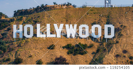 The Hollywood Sign is prominently displayed on the dry, grassy hills of Mount Lee in Los Angeles, California, symbolizing the entertainment industry. The Hollywood Sign is prominently displayed on the dry, grassy hills of Mount Lee in Los Angeles, California, symbolizing the entertainment industry. 119254105