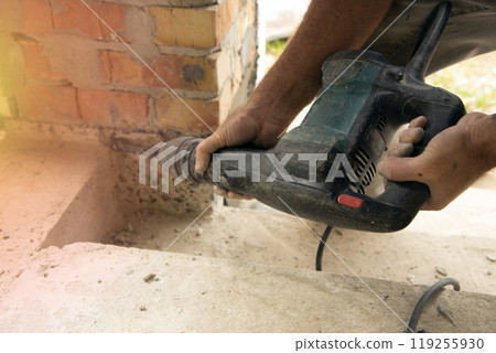 Worker using jackhammer Worker using jackhammer 119255930