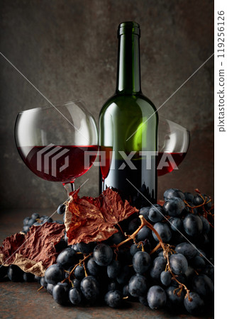 Red wine and blue grapes. 119256126