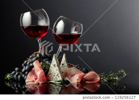 Red wine with grapes, rosemary, prosciutto, and blue cheese. 119256127