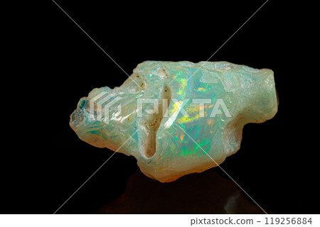 macro mineral stone rare and beautiful opals on a black background macro mineral stone rare and beautiful opals on a black background 119256884