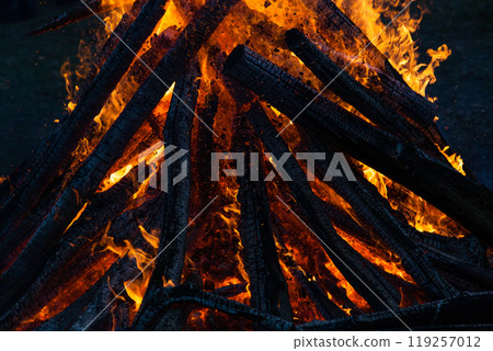 Beautiful fire flames on a campfire 119257012